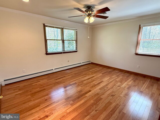 265 Asbury Rd, Egg Harbor Township, NJ 08234 - spare room featuring crown molding, light wood-style flooring, a ceiling fan, baseboards, and a baseboard heating unit