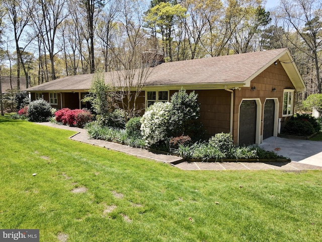265 Asbury Rd, Egg Harbor Township, NJ 08234 - view of home's exterior with an attached garage, roof with shingles, a lawn, and concrete driveway