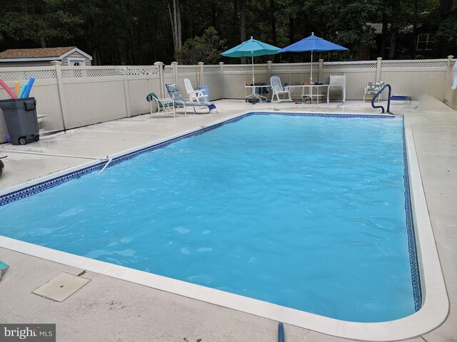 265 Asbury Rd, Egg Harbor Township, NJ 08234 - view of swimming pool featuring a fenced in pool, fence, and a patio