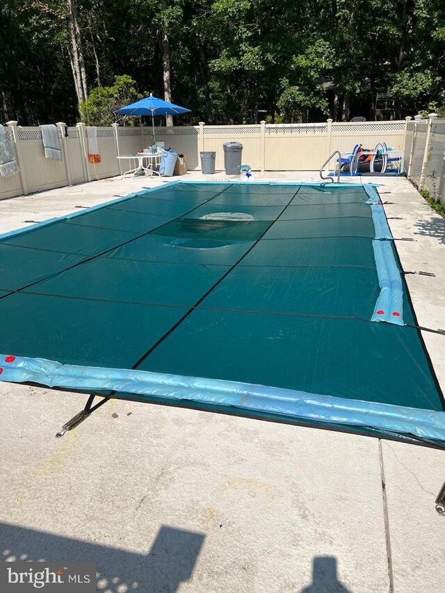 265 Asbury Rd, Egg Harbor Township, NJ 08234 - view of swimming pool featuring a fenced in pool, fence, and a patio
