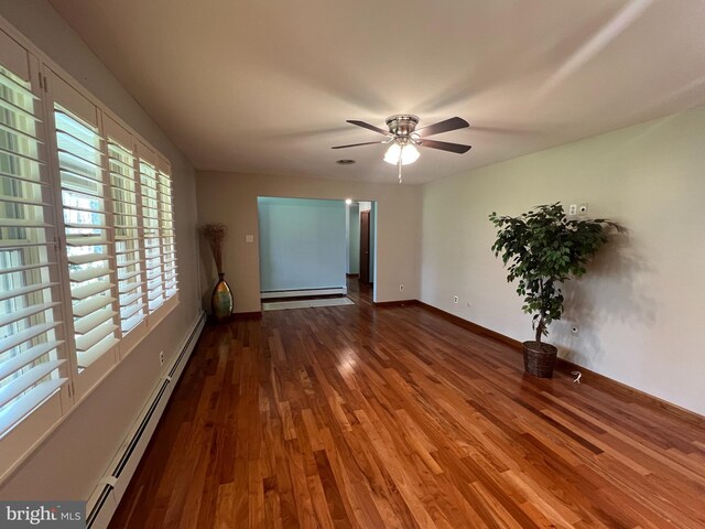 265 Asbury Rd, Egg Harbor Township, NJ 08234 - empty room featuring ceiling fan, baseboard heating, baseboards, wood finished floors, and a baseboard heating unit