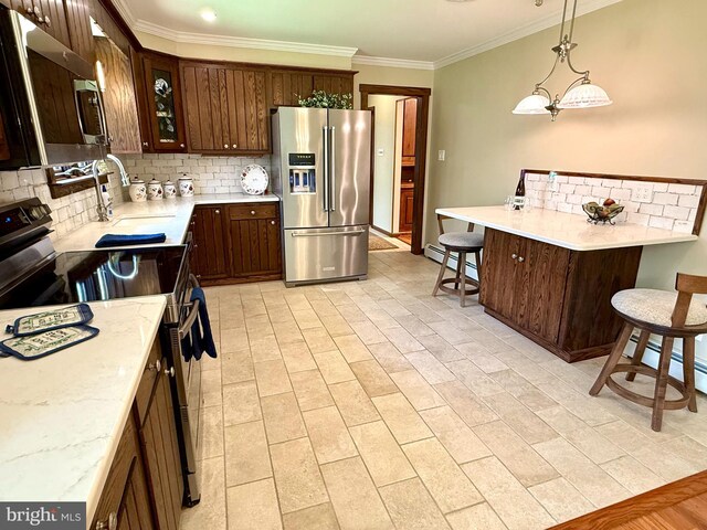 265 Asbury Rd, Egg Harbor Township, NJ 08234 - kitchen featuring decorative backsplash, a breakfast bar area, appliances with stainless steel finishes, a sink, and ornamental molding