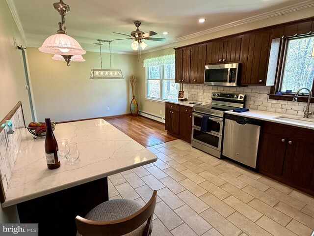 265 Asbury Rd, Egg Harbor Township, NJ 08234 - kitchen with crown molding, a baseboard heating unit, appliances with stainless steel finishes, and a sink