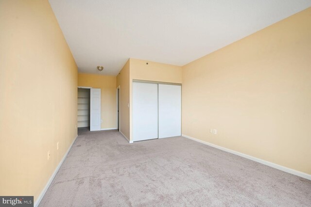 3200 N Leisure World Blvd Unit 1010, Silver Spring, MD 20906 - unfurnished bedroom featuring carpet, baseboards, and a closet