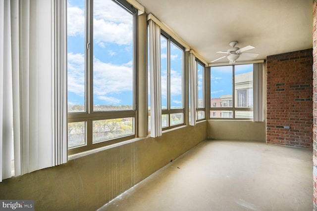 3200 N Leisure World Blvd Unit 1010, Silver Spring, MD 20906 - unfurnished sunroom featuring concrete flooring and brick wall