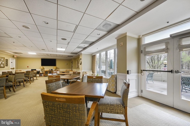 3200 N Leisure World Blvd Unit 1010, Silver Spring, MD 20906 - carpeted dining space with a wainscoted wall, a drop ceiling, a decorative wall, and french doors