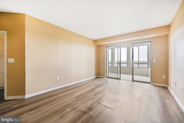 3200 N Leisure World Blvd Unit 1010, Silver Spring, MD 20906 - spare room with light wood-style floors and baseboards