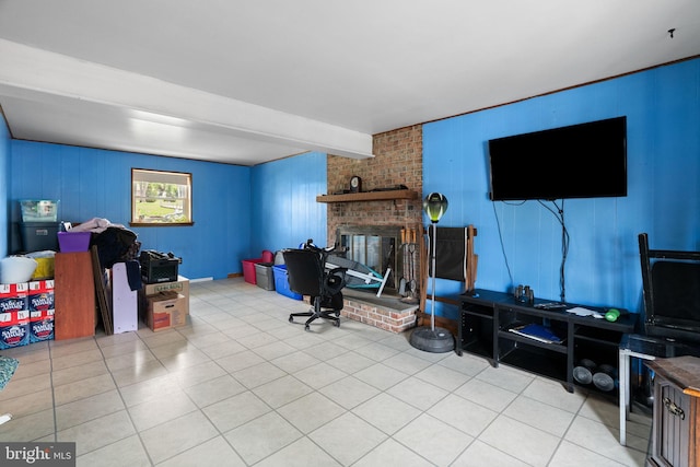 tiled living room featuring a brick fireplace