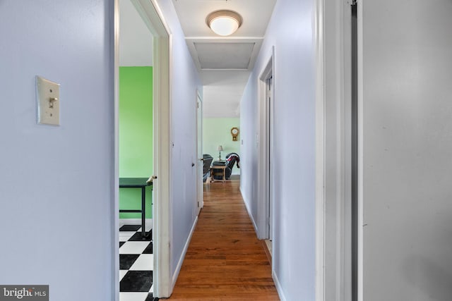 hall with wood finished floors