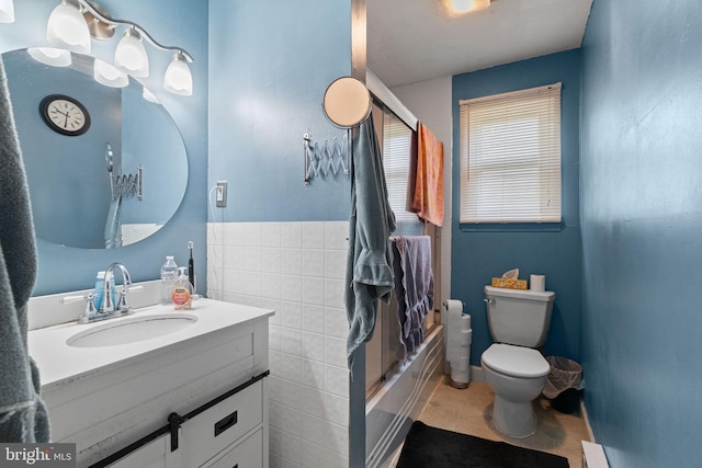 full bathroom featuring vanity, shower / tub combination, tile patterned flooring, and toilet
