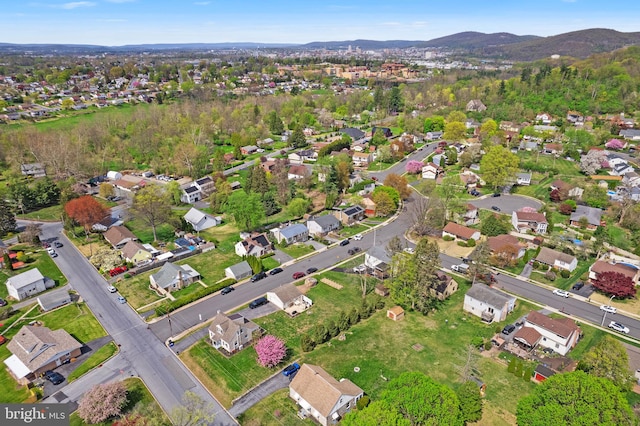 birds eye view of property with a mountain view and a residential view