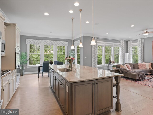 41909 Paddock Gate Pl, Ashburn, VA 20148 - kitchen with a sink, recessed lighting, open floor plan, stainless steel appliances, and crown molding
