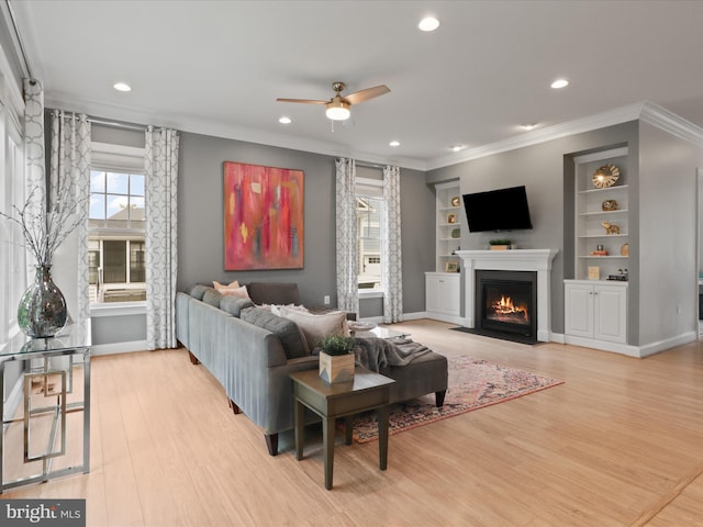 41909 Paddock Gate Pl, Ashburn, VA 20148 - living area with ceiling fan, light wood-type flooring, recessed lighting, a fireplace with flush hearth, and baseboards