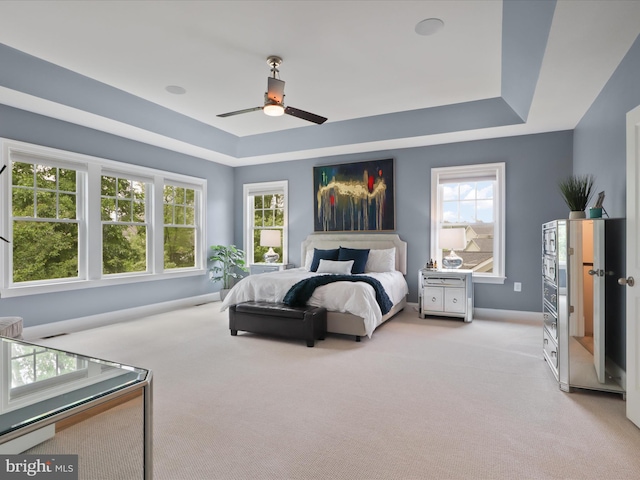 41909 Paddock Gate Pl, Ashburn, VA 20148 - bedroom with light colored carpet, a raised ceiling, baseboards, and a ceiling fan