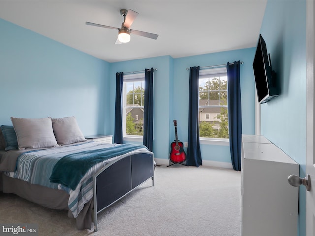 41909 Paddock Gate Pl, Ashburn, VA 20148 - bedroom with light carpet, baseboards, and a ceiling fan