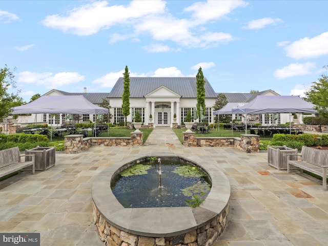 41909 Paddock Gate Pl, Ashburn, VA 20148 - view of home's community with a patio