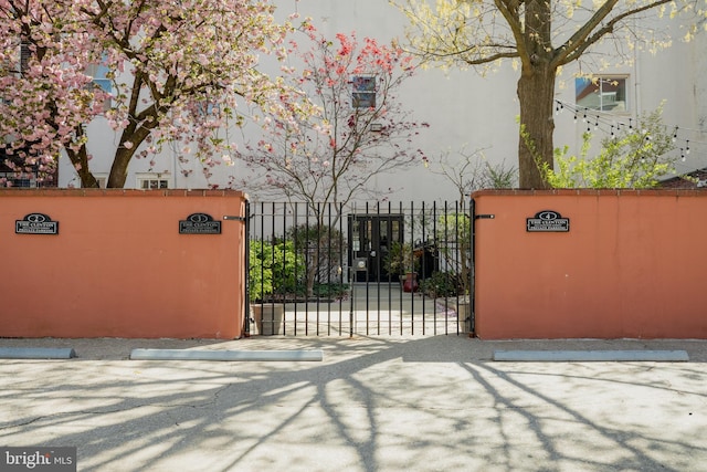 view of gate with fence