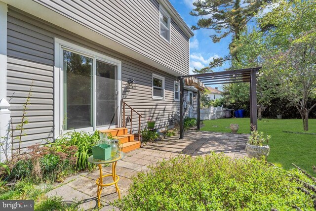 view of yard featuring a patio, fence, and a pergola