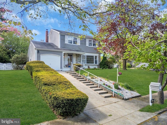 traditional home with fence, an attached garage, a front lawn, a chimney, and driveway