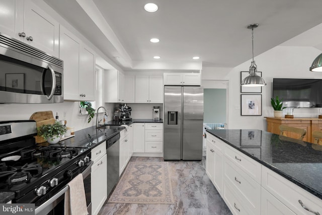 kitchen with white cabinets, stainless steel appliances, recessed lighting, and a sink