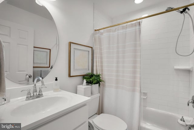 full bathroom with vanity, toilet, and shower / tub combo with curtain