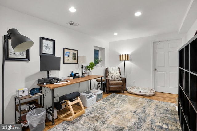 home office with visible vents, recessed lighting, and wood finished floors