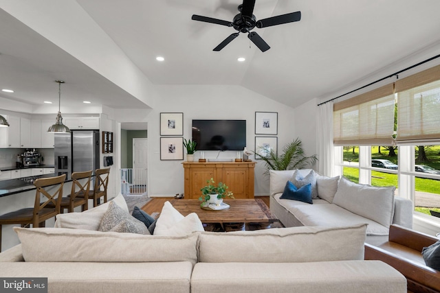 living area featuring recessed lighting, a ceiling fan, wood finished floors, and vaulted ceiling