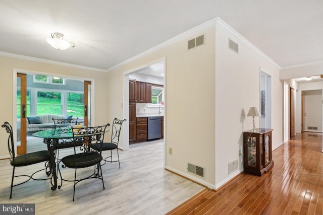 2602 Jeffrey Lori Dr, Finksburg, MD 21048 - dining room featuring light wood finished floors, visible vents, baseboards, and ornamental molding