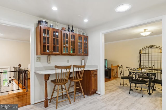 2602 Jeffrey Lori Dr, Finksburg, MD 21048 - kitchen featuring ornamental molding, light countertops, and glass insert cabinets