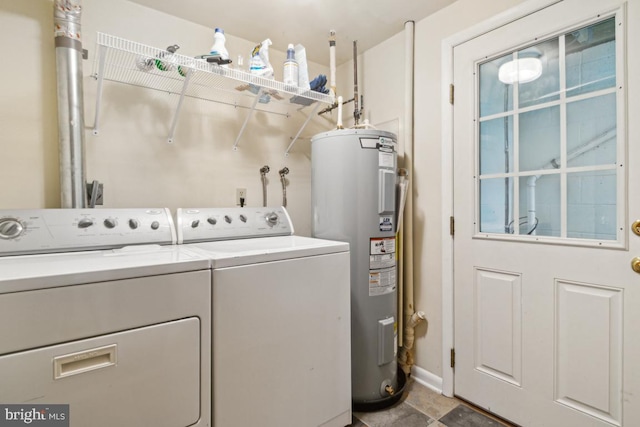 2602 Jeffrey Lori Dr, Finksburg, MD 21048 - clothes washing area featuring laundry area, electric water heater, separate washer and dryer, and baseboards