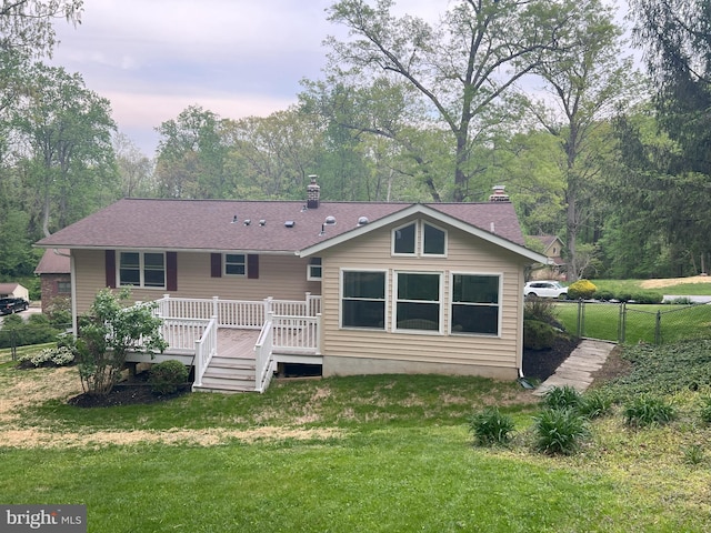 2602 Jeffrey Lori Dr, Finksburg, MD 21048 - back of property with a lawn, a chimney, fence, a shingled roof, and a wooden deck