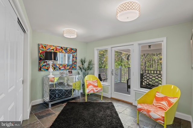 5419 Ragged Point Rd, Cambridge, MD 21613 - living area featuring baseboards and stone tile flooring