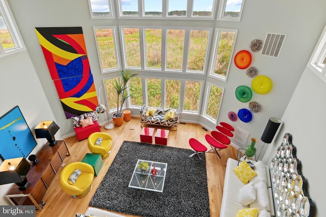 5419 Ragged Point Rd, Cambridge, MD 21613 - recreation room featuring a high ceiling, wood finished floors, and baseboards
