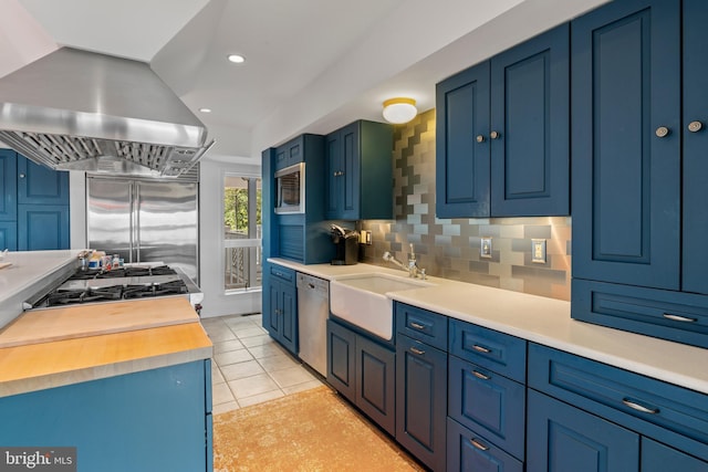 5419 Ragged Point Rd, Cambridge, MD 21613 - kitchen featuring a sink, stainless steel appliances, island range hood, tasteful backsplash, and wood counters