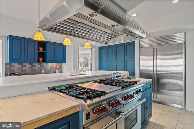 5419 Ragged Point Rd, Cambridge, MD 21613 - kitchen featuring premium appliances, extractor fan, blue cabinetry, light countertops, and recessed lighting