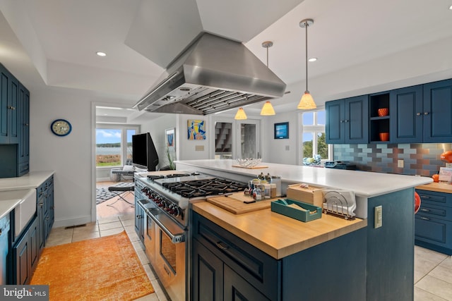 5419 Ragged Point Rd, Cambridge, MD 21613 - kitchen with high end stainless steel range oven, island range hood, wood counters, a kitchen island, and recessed lighting