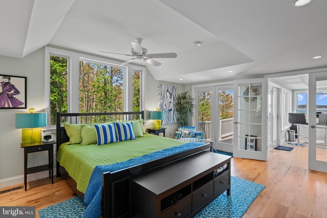 5419 Ragged Point Rd, Cambridge, MD 21613 - bedroom with access to exterior, multiple windows, wood finished floors, vaulted ceiling, and recessed lighting