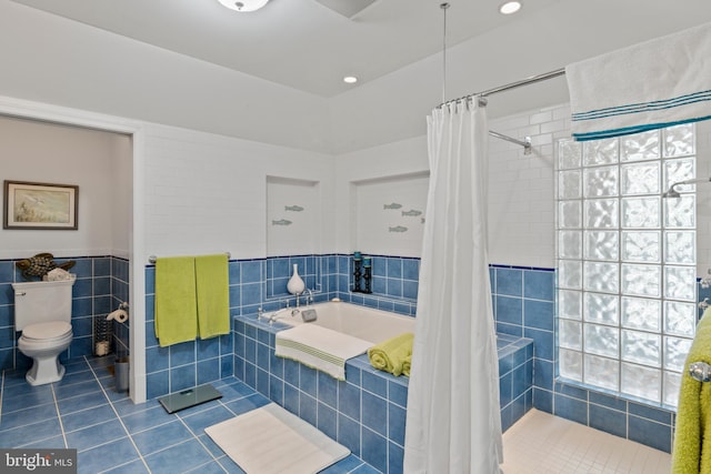 5419 Ragged Point Rd, Cambridge, MD 21613 - full bath with tile patterned floors, tile walls, a tile shower, tiled bath, and toilet