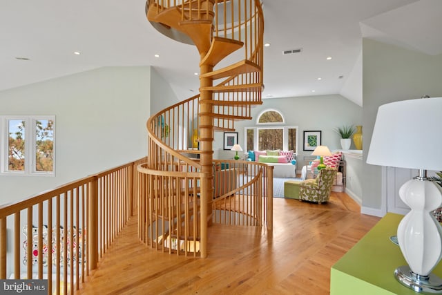 5419 Ragged Point Rd, Cambridge, MD 21613 - stairs with vaulted ceiling, wood finished floors, and recessed lighting