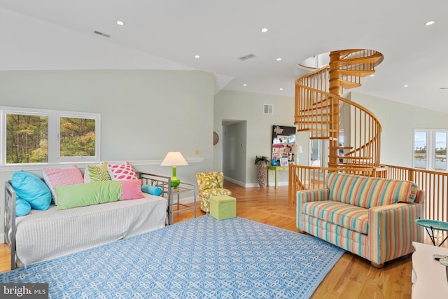 5419 Ragged Point Rd, Cambridge, MD 21613 - living room featuring stairs, wood finished floors, baseboards, recessed lighting, and high vaulted ceiling