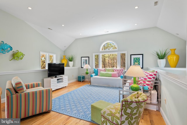 5419 Ragged Point Rd, Cambridge, MD 21613 - living area with lofted ceiling, healthy amount of natural light, wood finished floors, recessed lighting, and baseboards