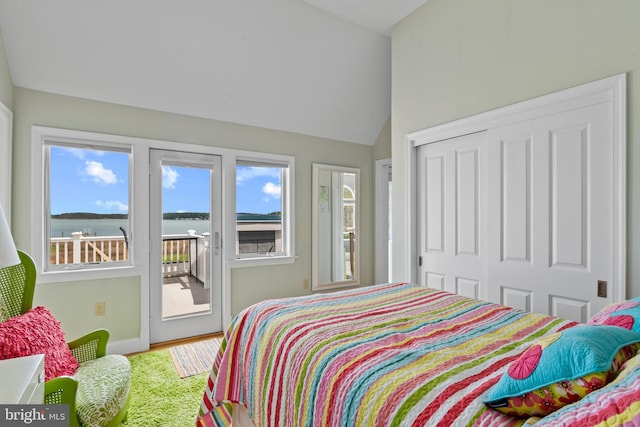 5419 Ragged Point Rd, Cambridge, MD 21613 - bedroom featuring access to exterior, multiple windows, lofted ceiling, a closet, and a water view