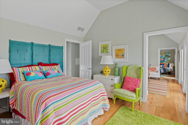 5419 Ragged Point Rd, Cambridge, MD 21613 - bedroom with vaulted ceiling and wood finished floors