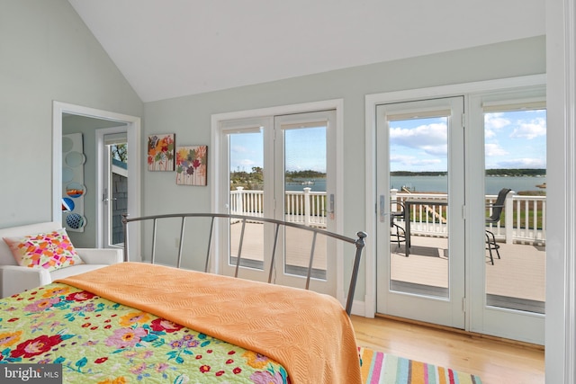 5419 Ragged Point Rd, Cambridge, MD 21613 - bedroom with access to outside, light wood-style flooring, vaulted ceiling, and a water view