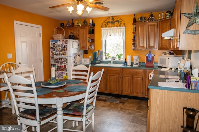 216 Laurel Ct, Pine Grove, PA 17963 - kitchen with a ceiling fan, range hood, brown cabinets, a sink, and white appliances