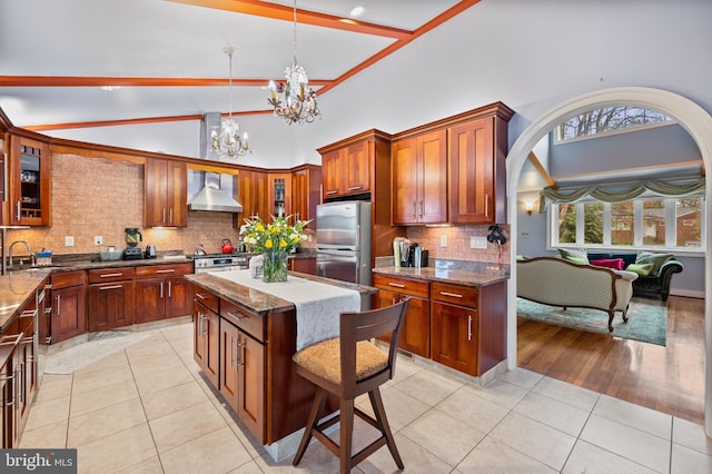 1110 Brantford Ave, Silver Spring, MD 20904 - kitchen with stone counters, light tile patterned floors, freestanding refrigerator, a chandelier, and glass insert cabinets