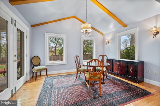1110 Brantford Ave, Silver Spring, MD 20904 - dining space featuring light wood-type flooring, a chandelier, a healthy amount of sunlight, and vaulted ceiling