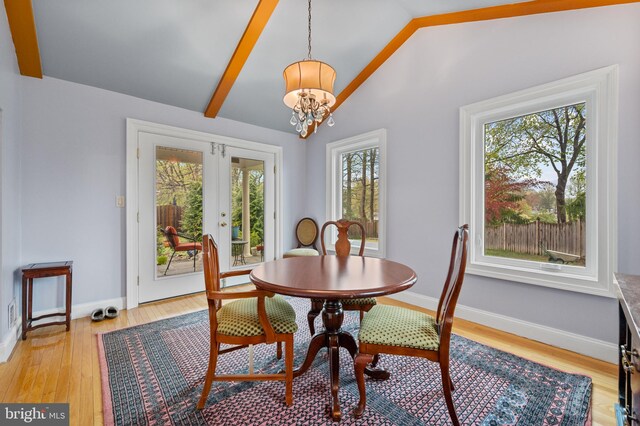 1110 Brantford Ave, Silver Spring, MD 20904 - dining area featuring lofted ceiling with beams, an inviting chandelier, french doors, baseboards, and light wood-type flooring