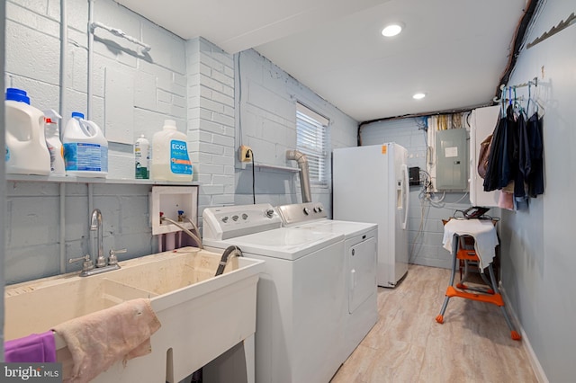 1110 Brantford Ave, Silver Spring, MD 20904 - laundry area featuring washer and dryer, laundry area, a sink, light wood-type flooring, and electric panel
