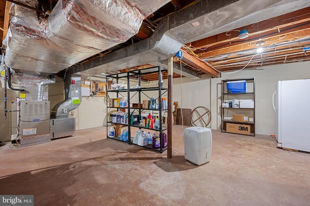 1110 Brantford Ave, Silver Spring, MD 20904 - unfinished below grade area with freestanding refrigerator, heating unit, and concrete block wall